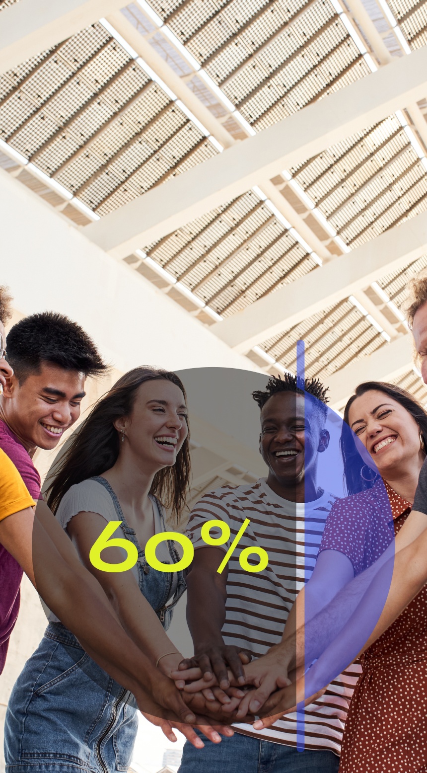 five young adults putting their hands together in a huddle