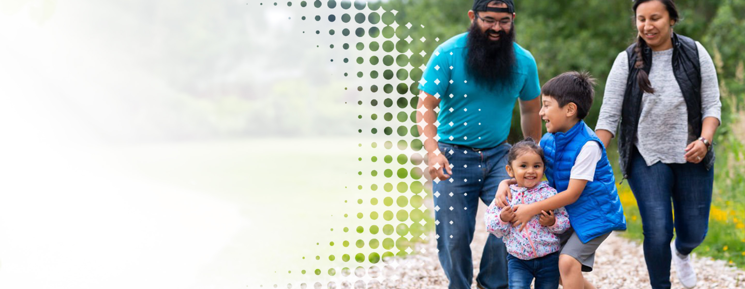 a family playing together while walking on an outdoor trail