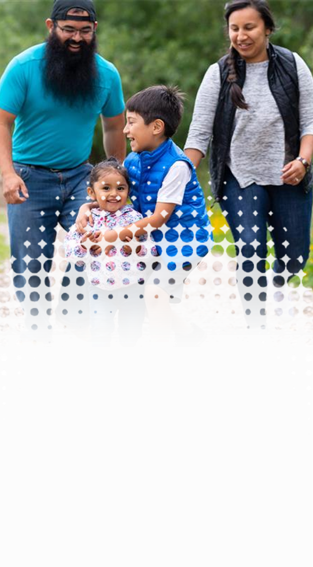a family playing together while walking on an outdoor trail