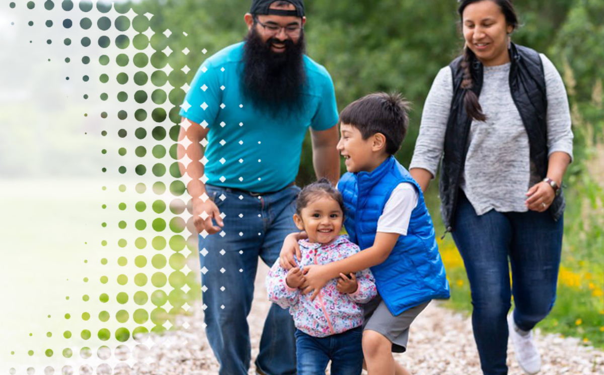 a family playing together while walking on an outdoor trail