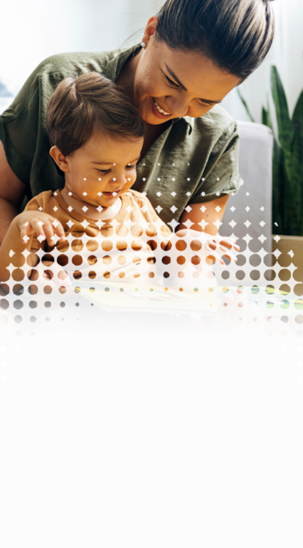 a mother reading a book with her young child