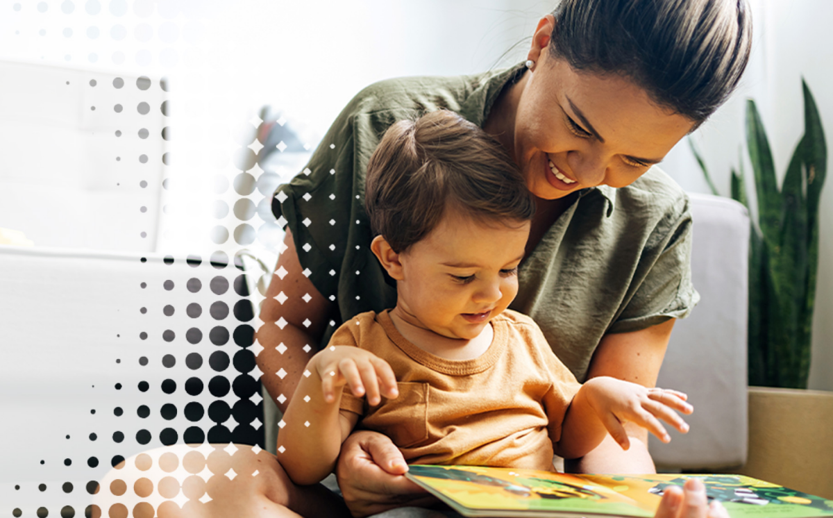 a mother reading a book with her young child