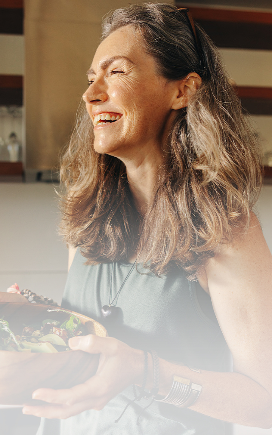 woman holding a salad
