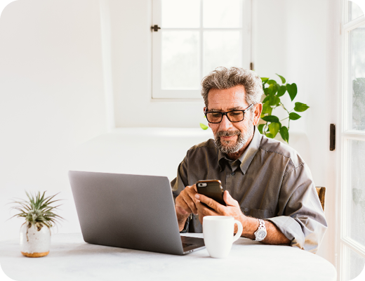 Man with Phone and Laptop