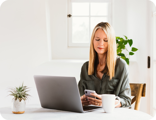 Woman with Phone and Laptop