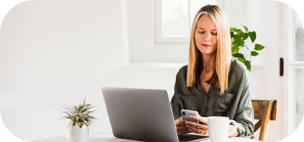 Woman with Phone and Laptop